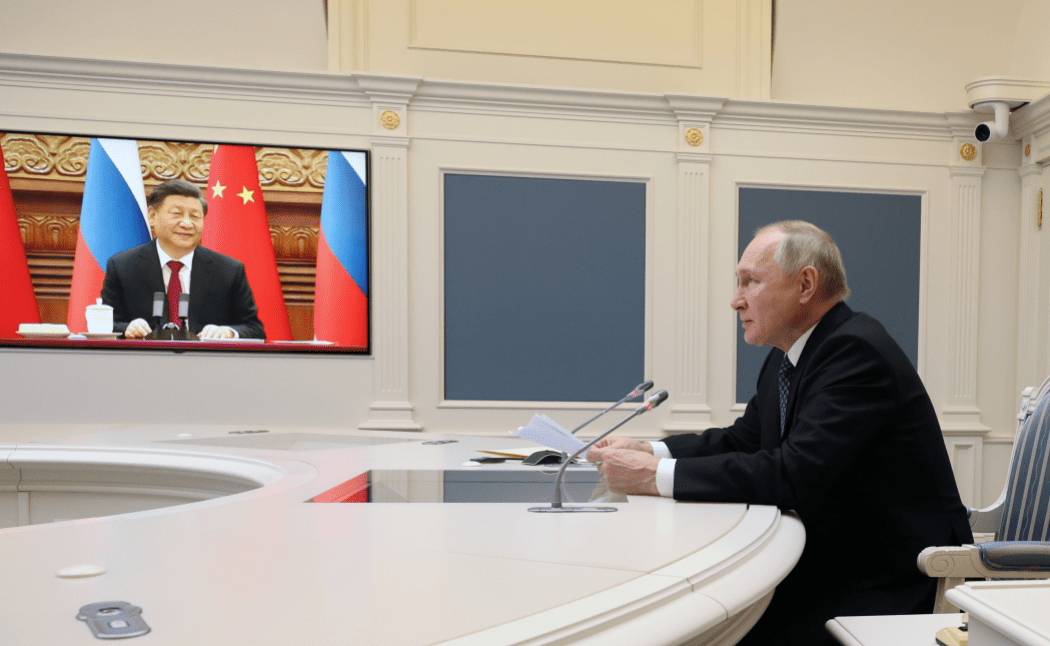 Russian President Vladimir Putin holds a meeting with Chinese President Xi Jinping via a video link at the Kremlin in Moscow on December 30, 2022. Photo: Mikhail Klimentyev/Sputnik/AFP.