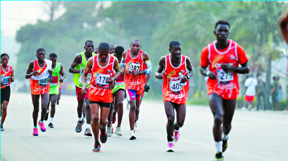 Runners pound the route but others are unable to finish after getting injured following the explosions. AFP