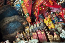 tatues at the main altar of hung shing temple in hong kong